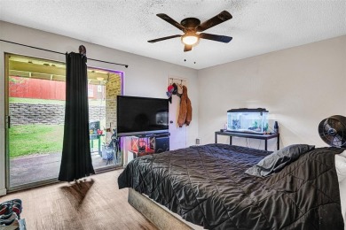 Tucked away behind a private fence, this beautifully updated on Mesquite Municipal Golf Course in Texas - for sale on GolfHomes.com, golf home, golf lot