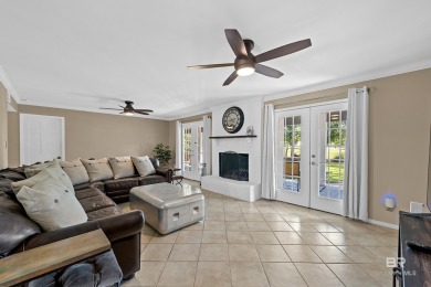 Located in Wedgewood Estates, this Gulf Shores retreat with a on The Golf Club of the Wharf in Alabama - for sale on GolfHomes.com, golf home, golf lot
