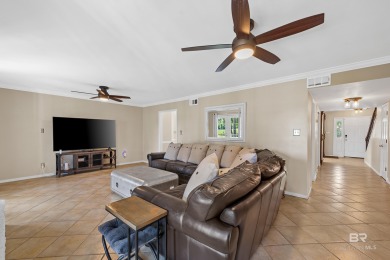 Located in Wedgewood Estates, this Gulf Shores retreat with a on The Golf Club of the Wharf in Alabama - for sale on GolfHomes.com, golf home, golf lot