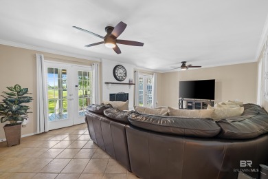 Located in Wedgewood Estates, this Gulf Shores retreat with a on The Golf Club of the Wharf in Alabama - for sale on GolfHomes.com, golf home, golf lot