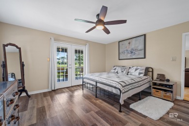 Located in Wedgewood Estates, this Gulf Shores retreat with a on The Golf Club of the Wharf in Alabama - for sale on GolfHomes.com, golf home, golf lot
