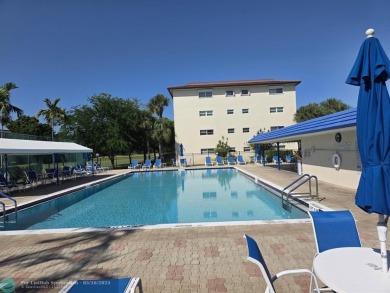 STUNNINGLY REMODELED 2BR/2BA CONDO, REIMAGINED WITH NO EXPENSE on Wynmoor Golf Course in Florida - for sale on GolfHomes.com, golf home, golf lot