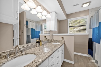 Located in Wedgewood Estates, this Gulf Shores retreat with a on The Golf Club of the Wharf in Alabama - for sale on GolfHomes.com, golf home, golf lot