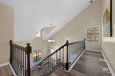 Located in Wedgewood Estates, this Gulf Shores retreat with a on The Golf Club of the Wharf in Alabama - for sale on GolfHomes.com, golf home, golf lot