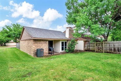 Tucked away behind a private fence, this beautifully updated on Mesquite Municipal Golf Course in Texas - for sale on GolfHomes.com, golf home, golf lot