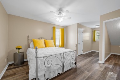 Located in Wedgewood Estates, this Gulf Shores retreat with a on The Golf Club of the Wharf in Alabama - for sale on GolfHomes.com, golf home, golf lot