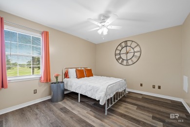 Located in Wedgewood Estates, this Gulf Shores retreat with a on The Golf Club of the Wharf in Alabama - for sale on GolfHomes.com, golf home, golf lot
