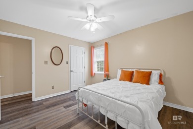 Located in Wedgewood Estates, this Gulf Shores retreat with a on The Golf Club of the Wharf in Alabama - for sale on GolfHomes.com, golf home, golf lot
