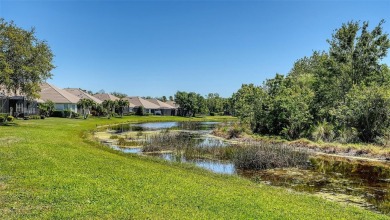RARELY AVAILABLE END UNIT WITH UNOBSTRUCTED, PEACEFUL AND on Legacy Golf Club in Florida - for sale on GolfHomes.com, golf home, golf lot