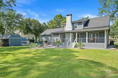 Located in Wedgewood Estates, this Gulf Shores retreat with a on The Golf Club of the Wharf in Alabama - for sale on GolfHomes.com, golf home, golf lot