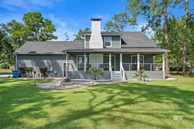 Located in Wedgewood Estates, this Gulf Shores retreat with a on The Golf Club of the Wharf in Alabama - for sale on GolfHomes.com, golf home, golf lot