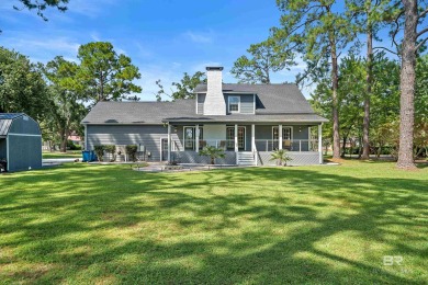 Located in Wedgewood Estates, this Gulf Shores retreat with a on The Golf Club of the Wharf in Alabama - for sale on GolfHomes.com, golf home, golf lot