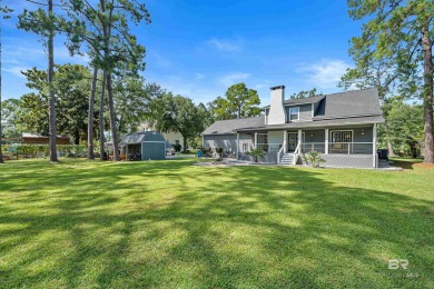 Located in Wedgewood Estates, this Gulf Shores retreat with a on The Golf Club of the Wharf in Alabama - for sale on GolfHomes.com, golf home, golf lot