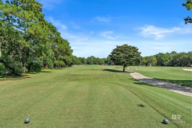 Located in Wedgewood Estates, this Gulf Shores retreat with a on The Golf Club of the Wharf in Alabama - for sale on GolfHomes.com, golf home, golf lot