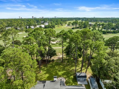 Located in Wedgewood Estates, this Gulf Shores retreat with a on The Golf Club of the Wharf in Alabama - for sale on GolfHomes.com, golf home, golf lot