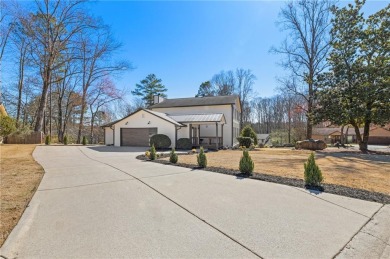 Sitting on an expansive corner lot in the prestigious Indian on Indian Hills Country Club in Georgia - for sale on GolfHomes.com, golf home, golf lot