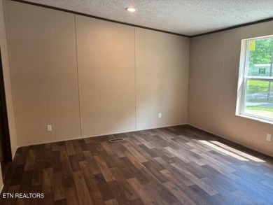 LOOK-BRAND NEW 2025 DOUBLE WIDE ON A CONCRETE BLOCK FOUNDATION on Lake Tansi Village Country Club in Tennessee - for sale on GolfHomes.com, golf home, golf lot