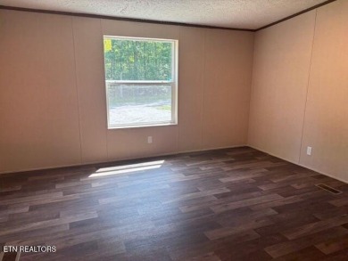 LOOK-BRAND NEW 2025 DOUBLE WIDE ON A CONCRETE BLOCK FOUNDATION on Lake Tansi Village Country Club in Tennessee - for sale on GolfHomes.com, golf home, golf lot