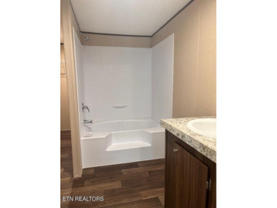 LOOK-BRAND NEW 2025 DOUBLE WIDE ON A CONCRETE BLOCK FOUNDATION on Lake Tansi Village Country Club in Tennessee - for sale on GolfHomes.com, golf home, golf lot