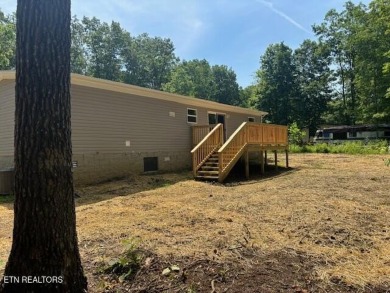 LOOK-BRAND NEW 2025 DOUBLE WIDE ON A CONCRETE BLOCK FOUNDATION on Lake Tansi Village Country Club in Tennessee - for sale on GolfHomes.com, golf home, golf lot