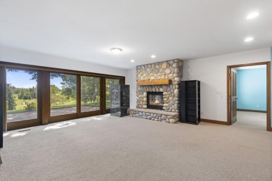Custom-designed cedar home on over 7.5 acres with 600' of on Bear Lake Highlands Golf Course in Michigan - for sale on GolfHomes.com, golf home, golf lot