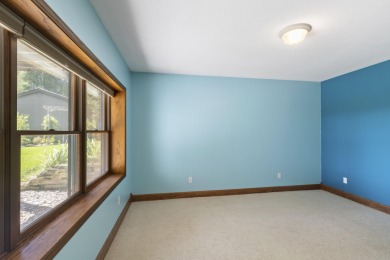 Custom-designed cedar home on over 7.5 acres with 600' of on Bear Lake Highlands Golf Course in Michigan - for sale on GolfHomes.com, golf home, golf lot