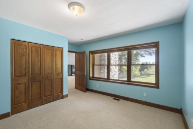 Custom-designed cedar home on over 7.5 acres with 600' of on Bear Lake Highlands Golf Course in Michigan - for sale on GolfHomes.com, golf home, golf lot