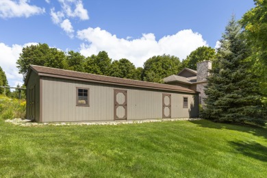 Custom-designed cedar home on over 7.5 acres with 600' of on Bear Lake Highlands Golf Course in Michigan - for sale on GolfHomes.com, golf home, golf lot