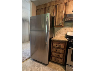 Discover comfort and convenience in this inviting 2-bedroom on Tucker Oaks Golf Course in California - for sale on GolfHomes.com, golf home, golf lot