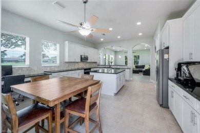Welcome to this STUNNING two-story, three-car garage home in the on Valencia Golf and Country Club in Florida - for sale on GolfHomes.com, golf home, golf lot