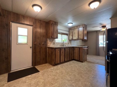 Discover comfort and convenience in this inviting 2-bedroom on Tucker Oaks Golf Course in California - for sale on GolfHomes.com, golf home, golf lot