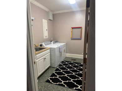 This Stunning 3-Bedroom Luxury Home with 4.5 Baths & Upstairs on Donalsonville Country Club in Georgia - for sale on GolfHomes.com, golf home, golf lot