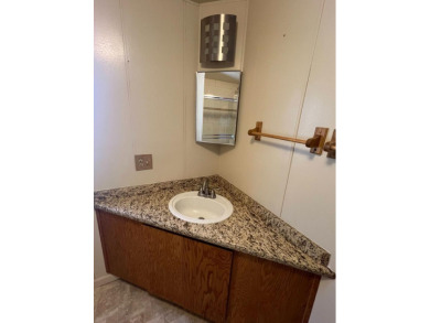 Discover comfort and convenience in this inviting 2-bedroom on Tucker Oaks Golf Course in California - for sale on GolfHomes.com, golf home, golf lot