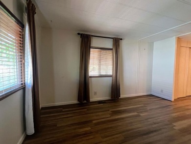 Discover comfort and convenience in this inviting 2-bedroom on Tucker Oaks Golf Course in California - for sale on GolfHomes.com, golf home, golf lot