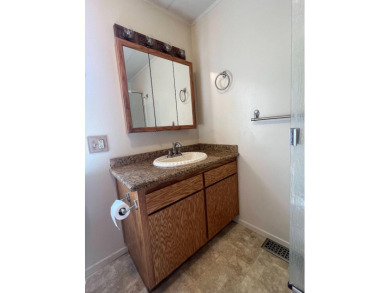 Discover comfort and convenience in this inviting 2-bedroom on Tucker Oaks Golf Course in California - for sale on GolfHomes.com, golf home, golf lot