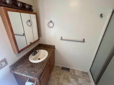Discover comfort and convenience in this inviting 2-bedroom on Tucker Oaks Golf Course in California - for sale on GolfHomes.com, golf home, golf lot