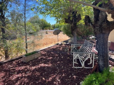 Discover comfort and convenience in this inviting 2-bedroom on Tucker Oaks Golf Course in California - for sale on GolfHomes.com, golf home, golf lot