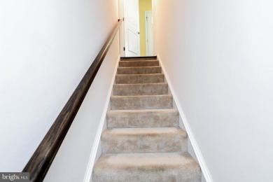 This spacious and beautifully updated 3-level single-family home on Lake Presidential Golf Club in Maryland - for sale on GolfHomes.com, golf home, golf lot