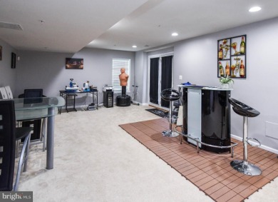 This spacious and beautifully updated 3-level single-family home on Lake Presidential Golf Club in Maryland - for sale on GolfHomes.com, golf home, golf lot