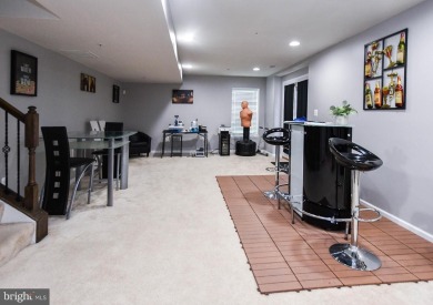 This spacious and beautifully updated 3-level single-family home on Lake Presidential Golf Club in Maryland - for sale on GolfHomes.com, golf home, golf lot