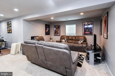 This spacious and beautifully updated 3-level single-family home on Lake Presidential Golf Club in Maryland - for sale on GolfHomes.com, golf home, golf lot