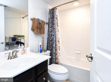 This spacious and beautifully updated 3-level single-family home on Lake Presidential Golf Club in Maryland - for sale on GolfHomes.com, golf home, golf lot