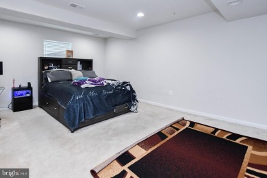 This spacious and beautifully updated 3-level single-family home on Lake Presidential Golf Club in Maryland - for sale on GolfHomes.com, golf home, golf lot