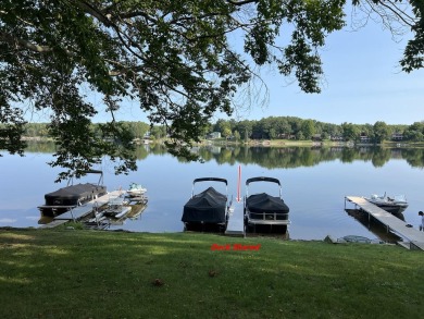 This is a must-see cozy cottage, located in Canadian Lakes with on Canadian Lakes Country Club-The Pines Course in Michigan - for sale on GolfHomes.com, golf home, golf lot