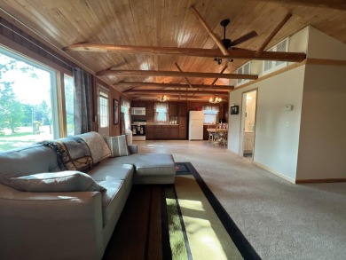 This is a must-see cozy cottage, located in Canadian Lakes with on Canadian Lakes Country Club-The Pines Course in Michigan - for sale on GolfHomes.com, golf home, golf lot