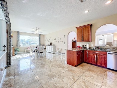 This light-filled home boasts beautiful views from the side of on Tuscawilla Country Club in Florida - for sale on GolfHomes.com, golf home, golf lot