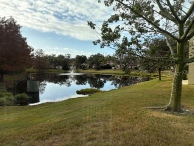 This light-filled home boasts beautiful views from the side of on Tuscawilla Country Club in Florida - for sale on GolfHomes.com, golf home, golf lot