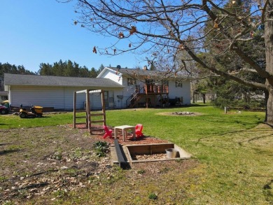 This property is ideally situated directly across from Pokegama on Pokegama Golf Course in Minnesota - for sale on GolfHomes.com, golf home, golf lot