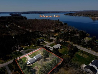 This property is ideally situated directly across from Pokegama on Pokegama Golf Course in Minnesota - for sale on GolfHomes.com, golf home, golf lot