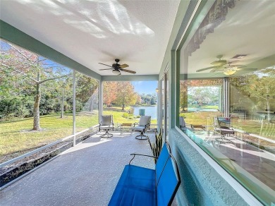 This light-filled home boasts beautiful views from the side of on Tuscawilla Country Club in Florida - for sale on GolfHomes.com, golf home, golf lot